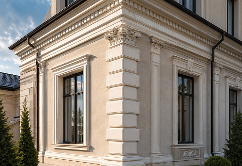 Corners of the house facade with stucco, rustication and decorative polyurethane elements