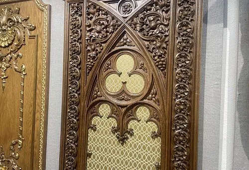 Carved wooden element with Gothic patterns, executed in a classic style with high detail.