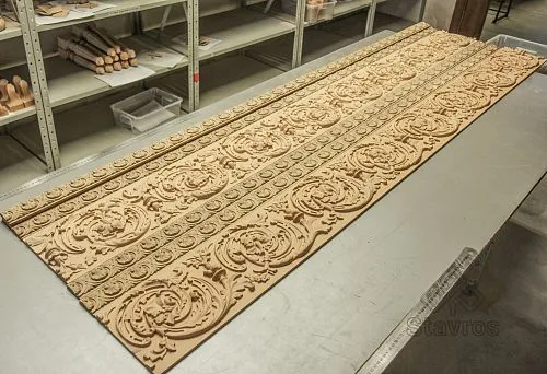 Carved wooden panels with ornament, arranged on a work desk