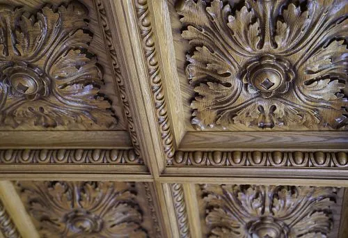 Carved ceiling panel made of oak with a classic leaf pattern