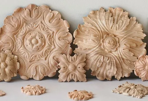 Carved wooden rosettes for interior decoration: classic decorative elements made of solid wood