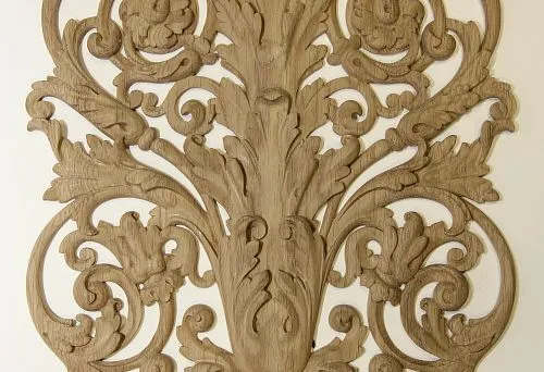Carved decorative wooden element in classic style for hotel interior design.