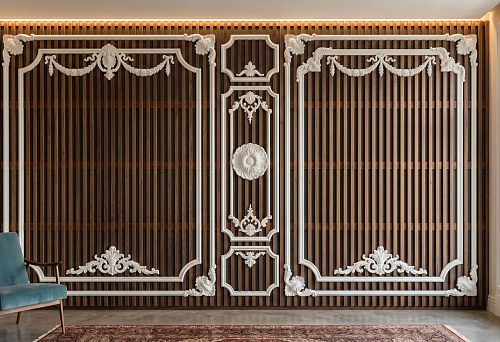 Acoustic wall with wooden slats and polyurethane stucco in interior