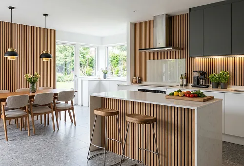 Slatted panels in a modern kitchen with an island, white fronts, wood trim, and a dining area