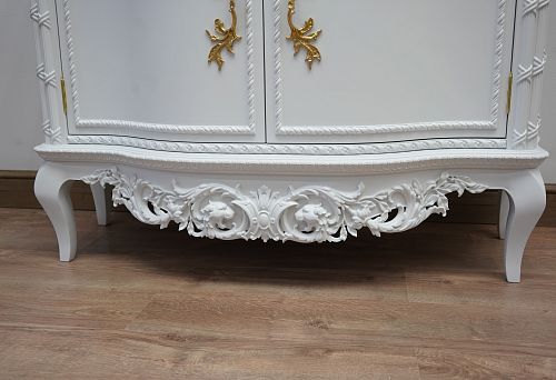 An elegant wooden chest with carved elements, crafted by masters as part of the furniture symphony