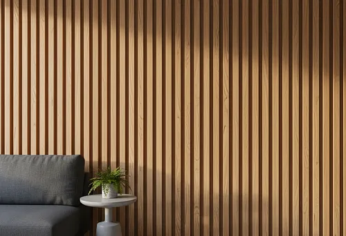 A wall clad with vertical wooden slats, creating an acoustic effect and visually elongating the room's proportions in a modern interior.