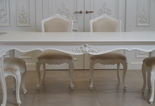 Classic dining table made of solid wood with refined details
