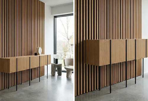 Slatted decorative panels on the wall and a console on thin supports: wall vertical rhythm and furniture height coordinated in one scale