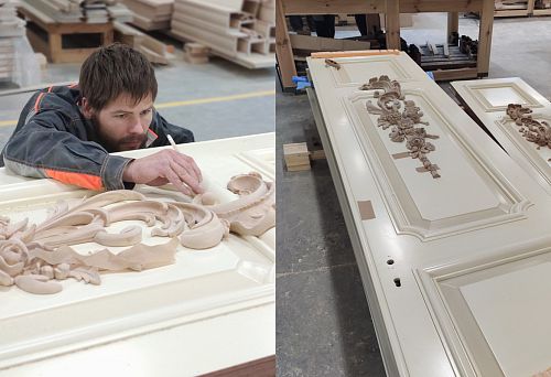 The craftsman is working on creating intricately carved wooden doors with refined decoration.