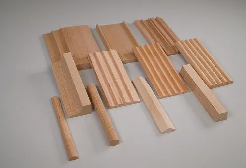 Various wooden profiles showcasing the possibilities of interior finishing and variety of shapes.