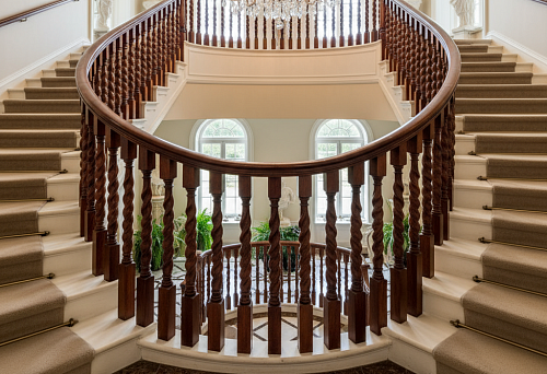 Luxury Staircase with Wooden Balusters and Forged Elements