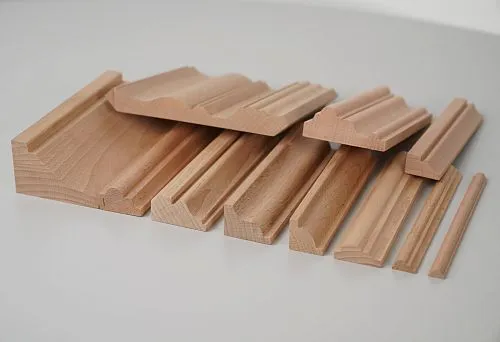 Set of wooden planks with different profiles from solid beech for decorative wall and ceiling finishing