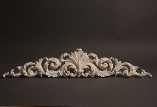 Carved wall ornament with curved lines and scrolls