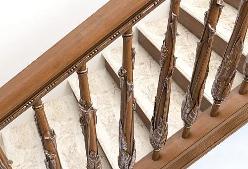 Wooden balusters with carved leaf elements and marble attic stairs
