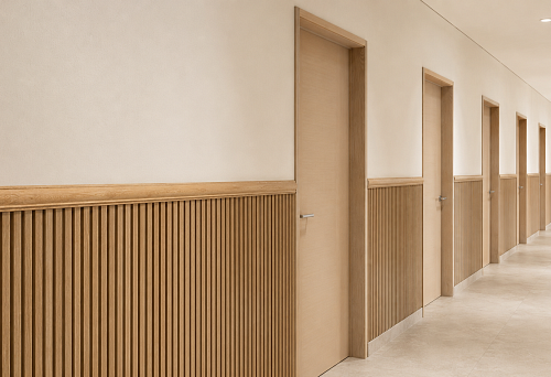 Wooden border MLD-043 above 1.1 m high slatted panels in a long corridor with five doors