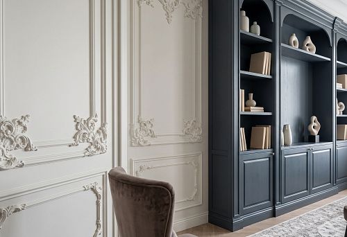 Stucco decor for the wall next to built-in furniture