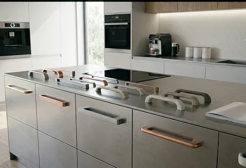 modern kitchen with a set of various furniture handles arranged on an island