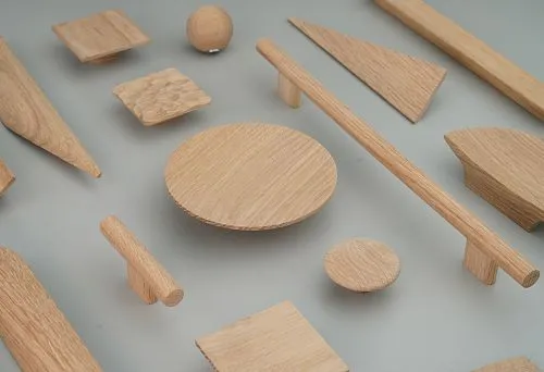 Wooden furniture handles of various sizes and shapes on the exhibition stand