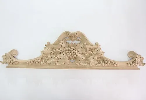 Carved wooden decorative element with grapevine ornament