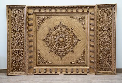 Three-dimensional carved ornament with classical patterns &ndash; the art of wood carving in interior design.