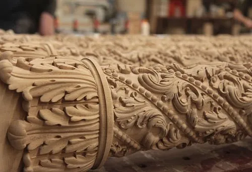 Fragment of carved relief sculpture with leaf, scroll, and bead ornament