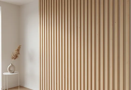 Modern wall made of beech planks in a light interior with minimalist decor