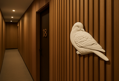 Decorative overlay NPU-497R "Bird" next to the room number in a boutique hotel