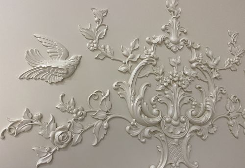 Luxurious ceiling moldings with flowers and birds in a classical style