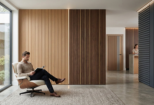 Decorative slatted panels on a wall in a modern interior with different wood shades and painted slats