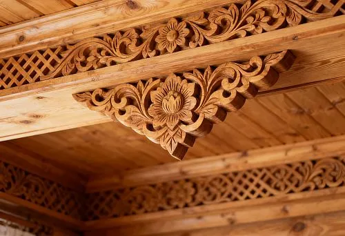 Carved Wooden Cornice with Russian Ornament and Floral Pattern in Natural Wood Interior