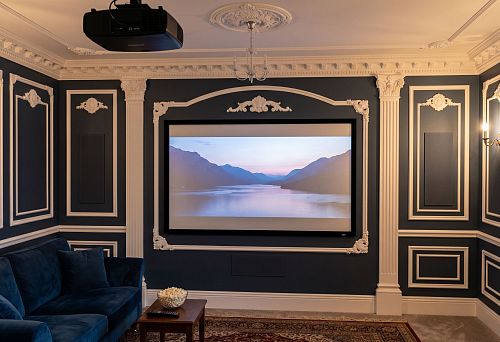 Stucco decor for the wall with a projector in a home theater