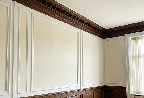 Classic interior with wall moldings and wooden cornice