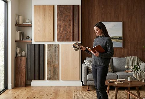 Wooden panels for interior wall decoration: samples of smooth, slatted and relief panels in the interior