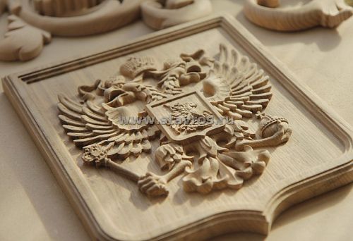 Large wood carving with state symbols