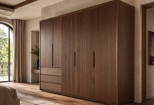 Wardrobe with slatted panels on the fronts in a modern interior