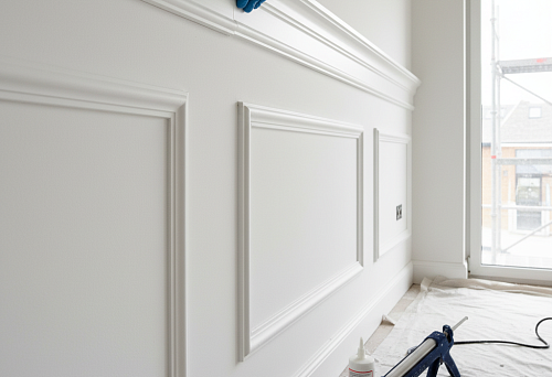 Process of installing polyurethane molding on a wall using sealant