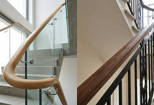 Round wooden handrail on a modern staircase with glass railing, smooth handrail turn