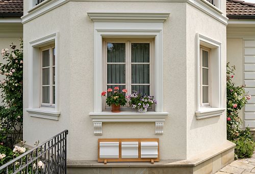 Polyurethane window sill belt for facade: how to choose the lower window framing
