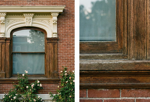 Classic window framing: facade polyurethane stucco molding with relief and wooden architrave