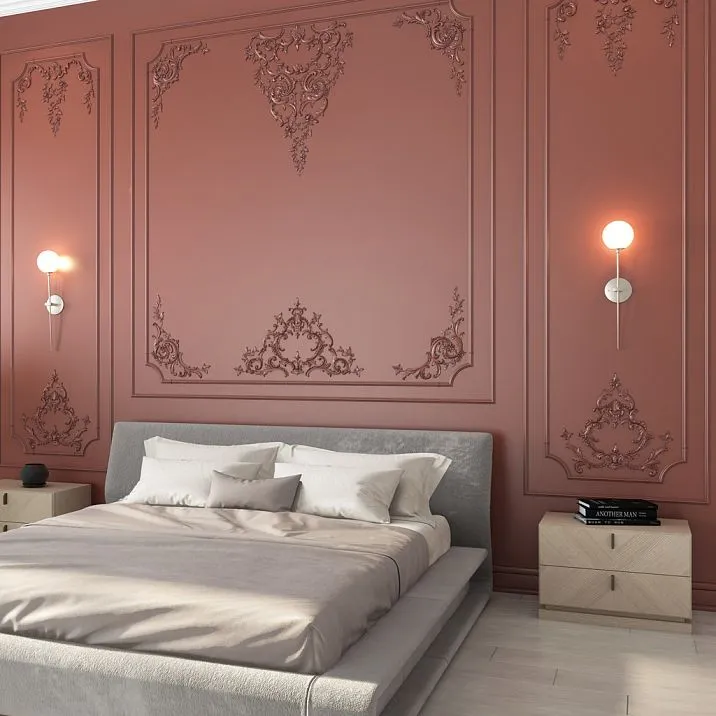 Bedroom with an accent wall made of STAVROS polyurethane moldings&mdash;frame decor in terracotta-pink tones with Baroque ornaments above the bed headboard