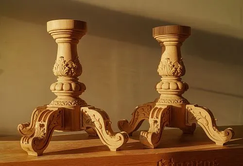 Two exclusive wooden pedestals with artistic carving on massive curved legs