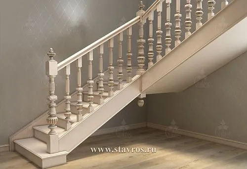 Light balusters with carved decoration and gilding in a classical interior