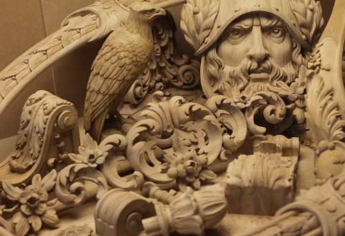 Fragment of Intricate Wood Carving: Helmeted Head, Bird Sculpture, Ornamental and Floral Motifs