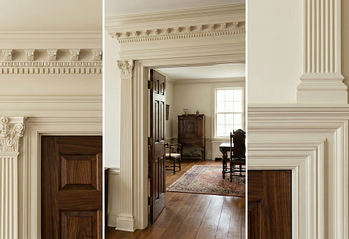 Door portal with moldings and cornice: classic door framing creates the effect of an architectural opening