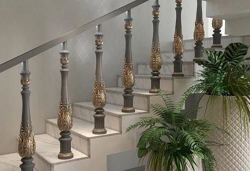 Balusters with gold decoration on the marble staircase on the second floor