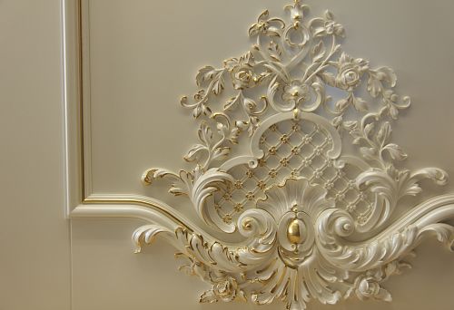 Luxurious interior with volumetric decorative elements and intricate wall patterns.