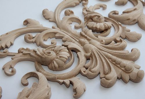 Carved wooden inlay with classic ornament for furniture modernization