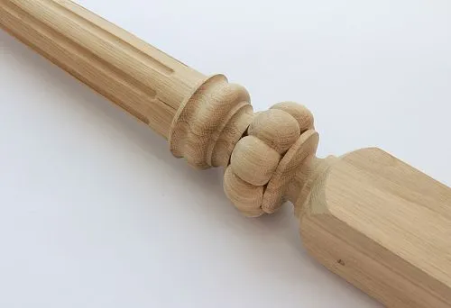 Decorative wooden baluster with carved ornament.