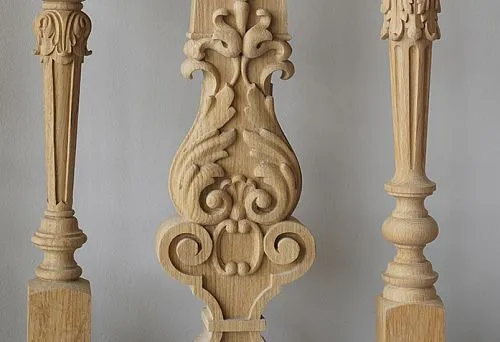 Flat wooden baluster with carved floral ornament in traditional style