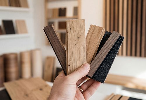 Wooden wall panels: samples of slatted wall panels made of MDF and solid wood for interior